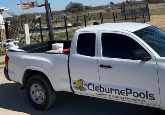 A white truck with the words " cleburne post ".